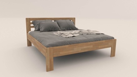 Łóżko z litego buku lub dębu, sprawiające wrażenie lekkiego