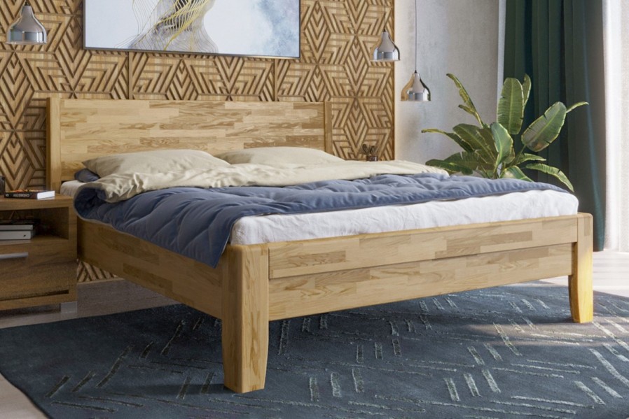 Solidne wykonane masywne łóżko Sion K1 stanie się godną ozdobą Twojej sypialni, wprowadzając do niej przytulność i komfort.